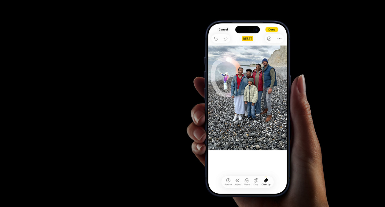 A hand holds iPhone 17 Pro, demonstrating the Apple Intelligence Live Translation feature during a phone call