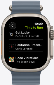 Apple Watch screen featuring a Fitness+ playlist including songs by The Weeknd, Skrillex, Justin Bieber, and Shawn Mendes