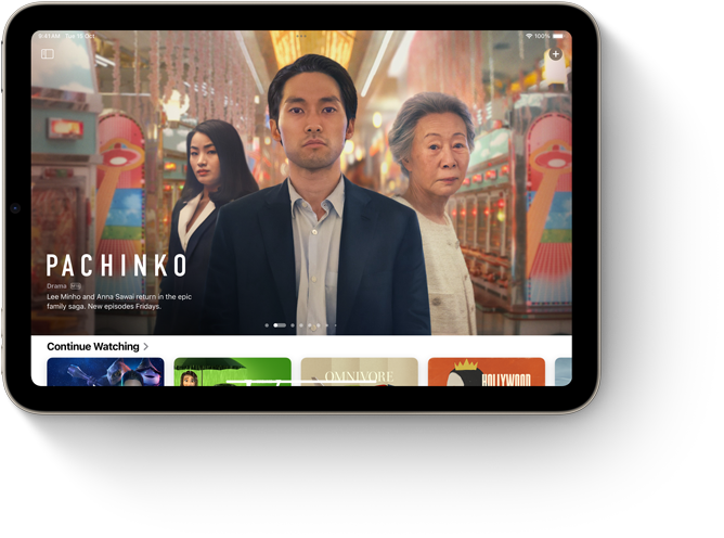 iPad mini, landscape orientation, displaying Apple Music with song lyrics.