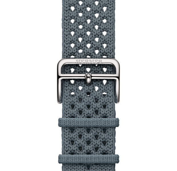 Apple Watch Hermès Series 11 Néo Tricot band, bleu gris color (blue gray), knit polyamide yarn material, adjustment holes centered, silver color buckle closure engraved with Hermès