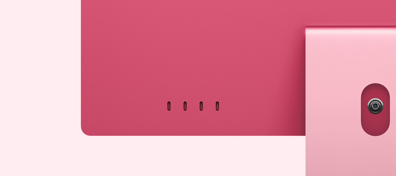 Vista posterior de una iMac rosa, que muestra los cuatro puertos USB-C