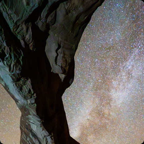 iPad Pro, front exterior, display showing a photograph of a rock structure in front of a star-filled night sky
