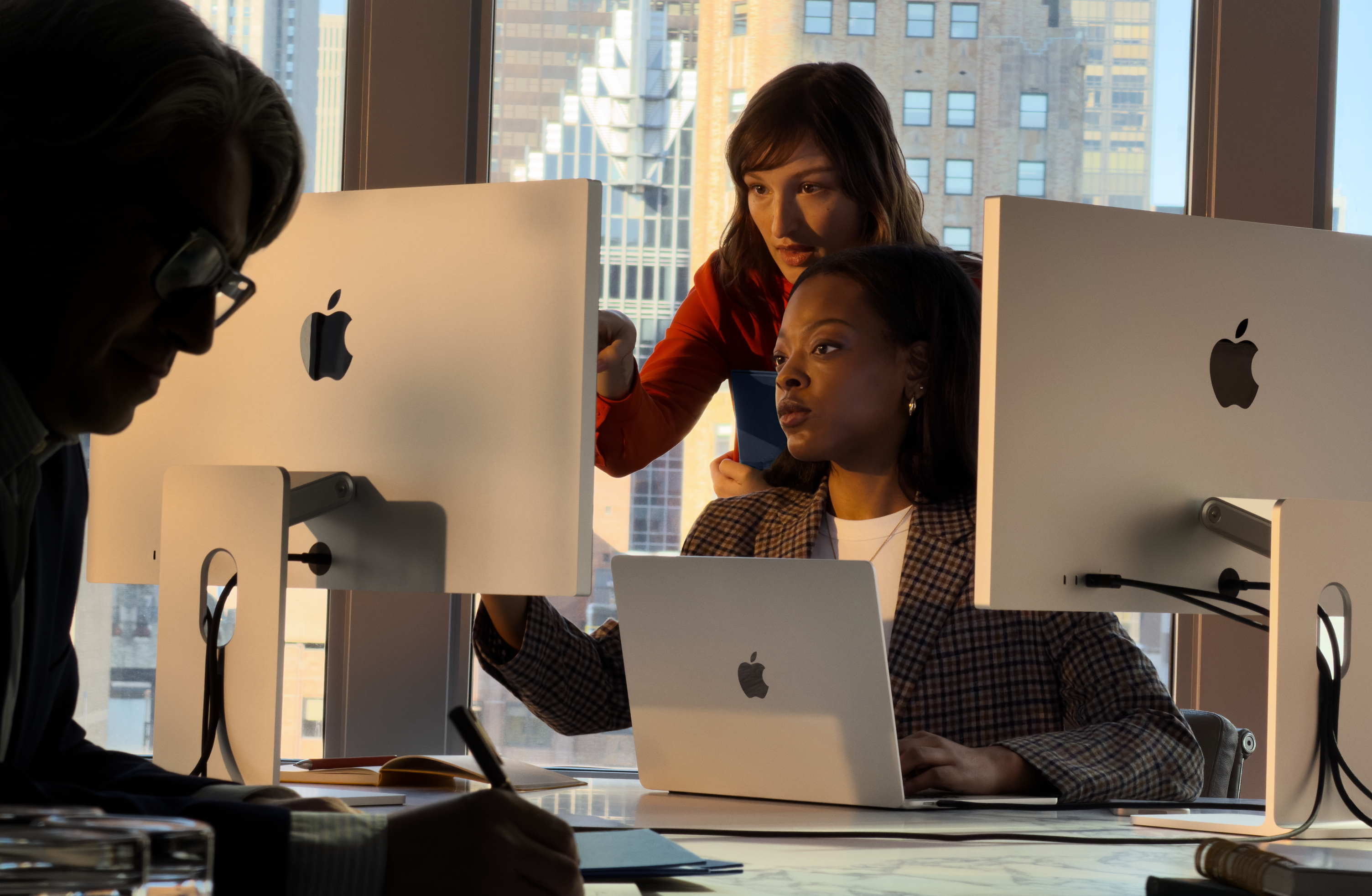 People using Mac in a work setting